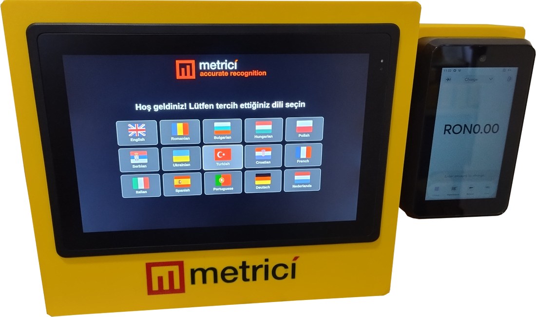 Metrici POS Payment Terminal — yellow kiosk with a 10-inch touchscreen showing the language selection screen, next to a 5-inch POS card reader displaying RON 0.00.